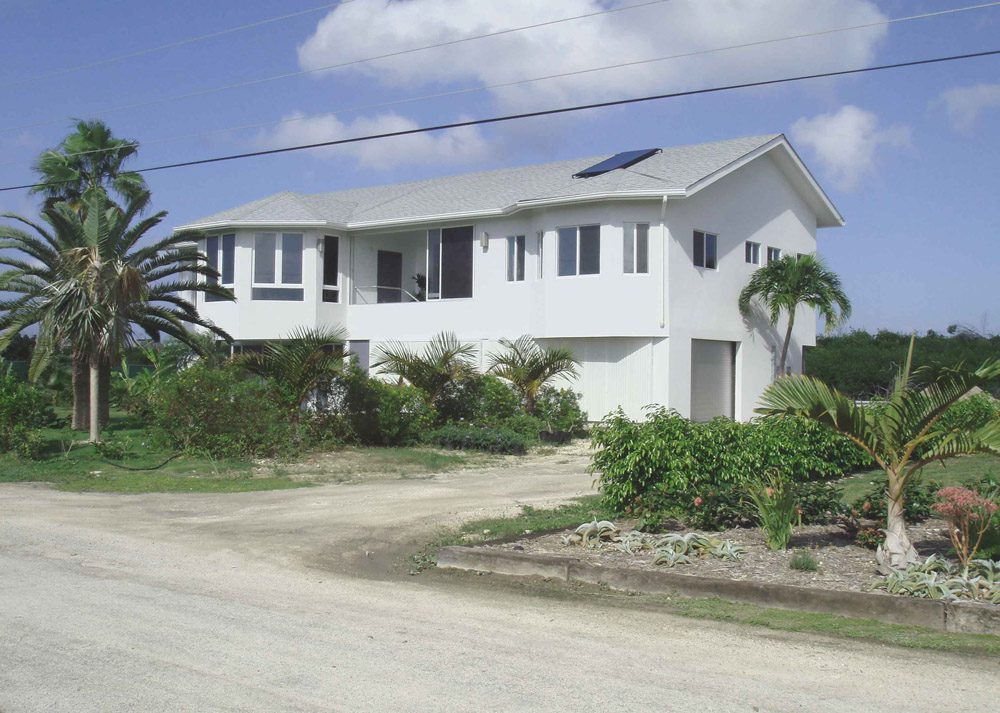 House with solar panel and garden